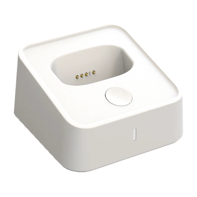White Sentinel charging dock showing the contact pins